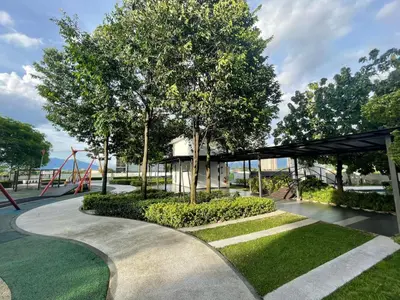 a park with a playground with a slide at Spacious Family Staycation 3BR at Ipoh Uptown in Ipoh