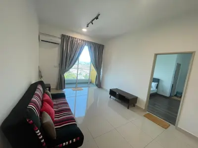 a living room with a couch and a large mirror at Spacious Family Staycation 3BR at Ipoh Uptown in Ipoh