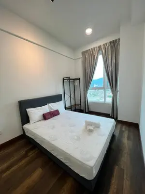 a bedroom with a large bed with a large window at Spacious Family Staycation 3BR at Ipoh Uptown in Ipoh