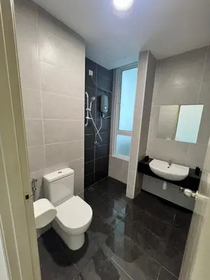 a bathroom with a toilet and a sink at Spacious Family Staycation 3BR at Ipoh Uptown in Ipoh