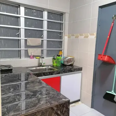 a kitchen with a sink and a window at Stobericekelathomestay in Cameron Highlands