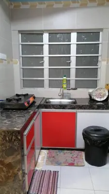 a kitchen with a sink and a counter top at Stobericekelathomestay in Cameron Highlands