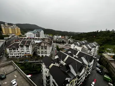 an aerial view of a city with buildings at Stoberi CekelatHomestay in Brinchang