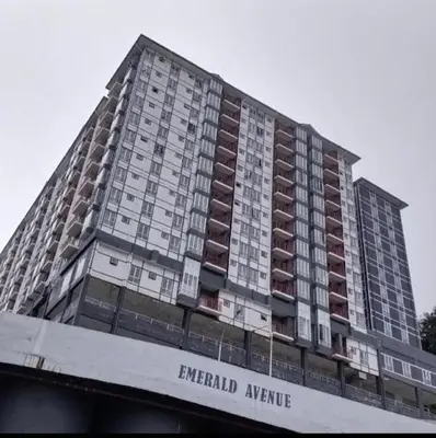 a tall apartment building with the words emerald avenue at Stoberi CekelatHomestay in Brinchang