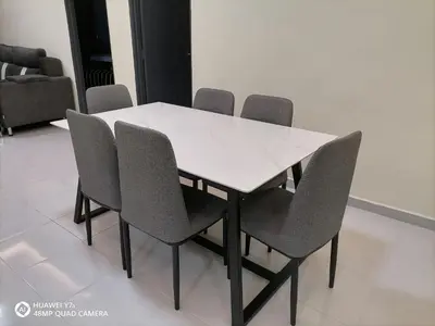 a white table and chairs in a room at StoberiCekelatHomestaymuslim's in Brinchang