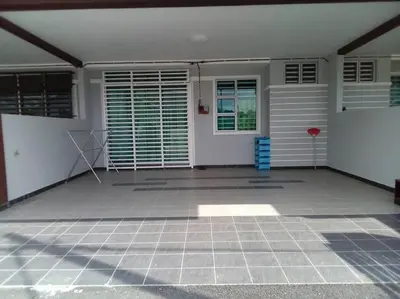 an empty room with a door and a patio at Percutian Di Taiping & Bukit Merah Laketown in Kamunting