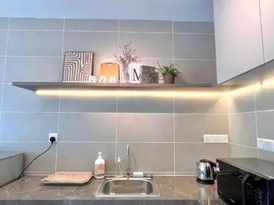 a kitchen with a sink and a shelf on the wall at 2-8pax Ipoh Nomado Onsen suites by Sunway Onsen Lost world of Tambun in Ipoh
