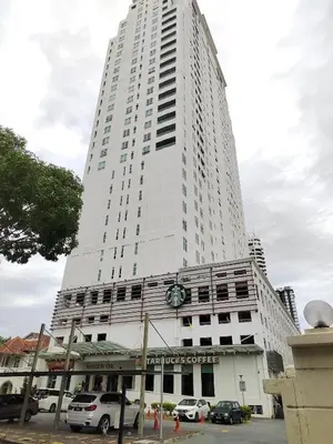 a tall white building with cars parked in front of it at Exclusive Studio/15th/ 1~4pax/ Gurney/ Mansion One in George Town