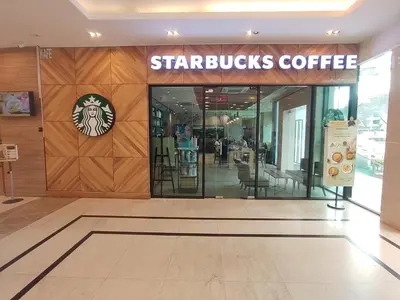 a starbucks coffee store with a sign on the wall at Exclusive Studio/15th/ 1~4pax/ Gurney/ Mansion One in George Town