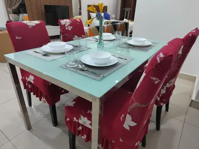 a table with red chairs and a blue table with plates and glasses at Exclusive Studio/15th/ 1~4pax/ Gurney/ Mansion One in George Town