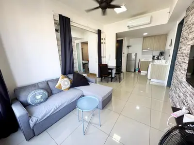 a living room with a couch and a kitchen at Tropicana 218 Macalister by CC in George Town