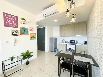 a kitchen with a table and chairs in a room at Tropicana 218 Macalister by CC in George Town