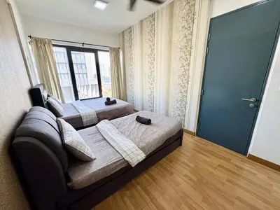 a bedroom with two beds and a large window at Tropicana 218 Macalister by CC in George Town