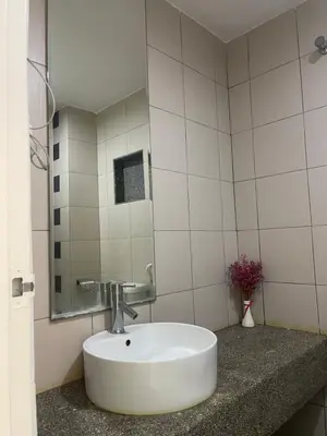 a bathroom with a sink and a mirror at Trails of Kampar in Kampar