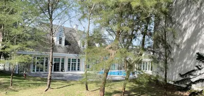an exterior view of a house with a pool at Trails of Kampar in Kampar