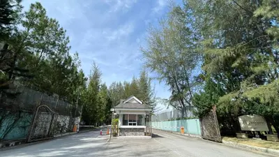 a small building in the middle of a street at Trails of Kampar in Kampar