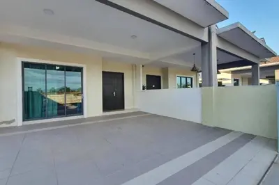 a large house with a white wall and a patio at Ipoh Meru Landed Semi D with Barbeque for 12 Pax in Ipoh
