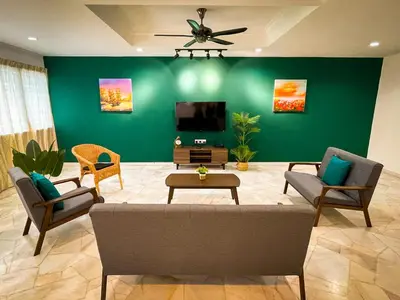 a living room with a couch and chairs and a tv at Lake View 53 Heritage 4BR by LOUIS in Taiping