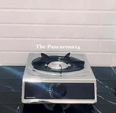 a toaster oven sitting on top of a table at The Pancarona24 Homestay forMuslim in Ipoh