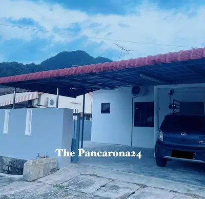 a car parked in front of a house at The Pancarona24 Homestay forMuslim in Ipoh