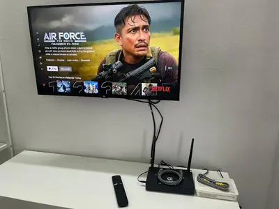 a tv on a wall with a camera on a desk at The Pancarona24 Homestay forMuslim in Ipoh