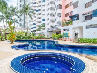 a swimming pool in front of a building at Sri Sayang Home Stay in George Town
