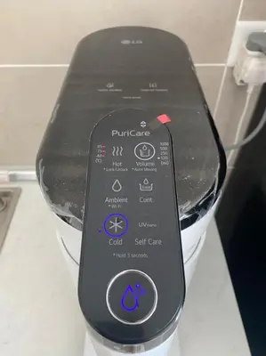 a remote control sitting on top of a toaster at Ipoh Tambun Lost World Sunway Onsen Suite 2R 8Pax Mira Theme Park View in Ipoh