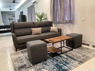 a living room with a couch and a coffee table at NEW 20PX 5BR V KTV & JACUZZI SPA & POOL TABLE at TOWN CENTER & USM - kids pool no more in Gelugor