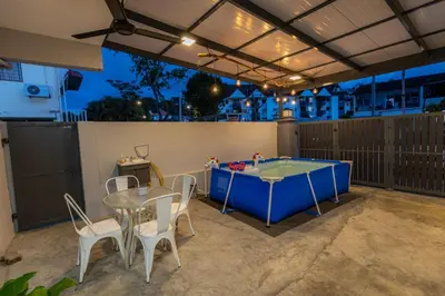 a patio with a ping pong table and chairs at 15Px 5BR V Jaccuzi Spa n KTV n Pool Table At Georgetown, USM n Lam Wah Ee Hospital -Kids pool no more in Gelugor