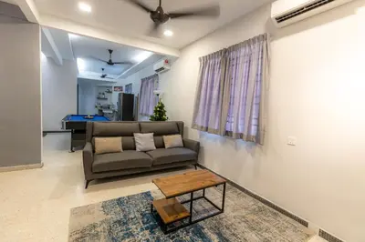 a living room with a couch and a table at 15Px 5BR V Jaccuzi Spa n KTV n Pool Table At Georgetown, USM n Lam Wah Ee Hospital -Kids pool no more in Gelugor