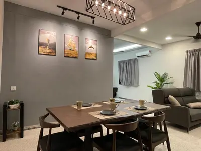 a dining room with a table and chairs at 15Px 5BR V Jaccuzi Spa n KTV n Pool Table At Georgetown, USM n Lam Wah Ee Hospital -Kids pool no more in Gelugor