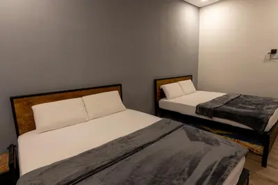 a room with two beds in a room at 15Px 5BR V Jaccuzi Spa n KTV n Pool Table At Georgetown, USM n Lam Wah Ee Hospital -Kids pool no more in Gelugor