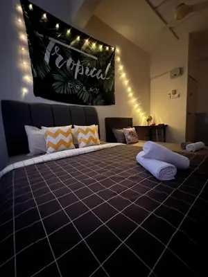 a bedroom with a large bed with lights on it at Room1#IG theme Bargainous#Shared Bathroom#3pax#2min Kek Lok Si in Ayer Itam