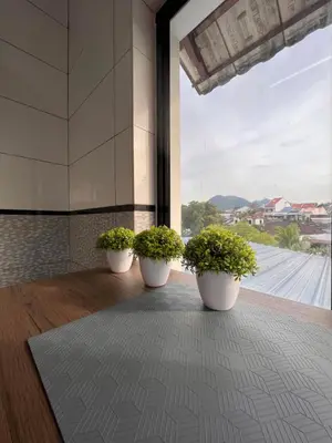 three potted plants in a room with a large window at Room2#IG theme Bargainous#Shared Bathroom#4pax#2min Kek Lok Si in Ayer Itam