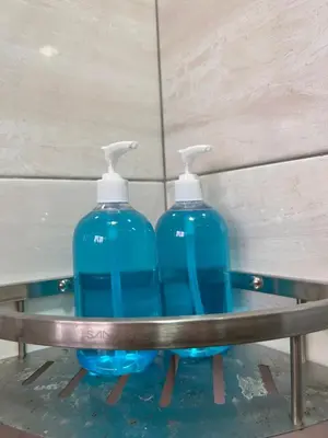 two blue bottles sitting on top of a table at Room2#IG theme Bargainous#Shared Bathroom#4pax#2min Kek Lok Si in Ayer Itam