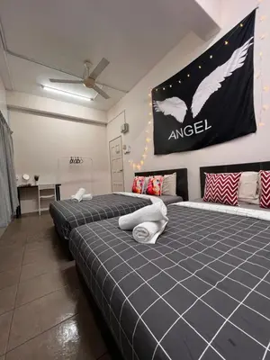 two beds in a room with a flag on the wall at Room2#IG theme Bargainous#Shared Bathroom#4pax#2min Kek Lok Si in Ayer Itam