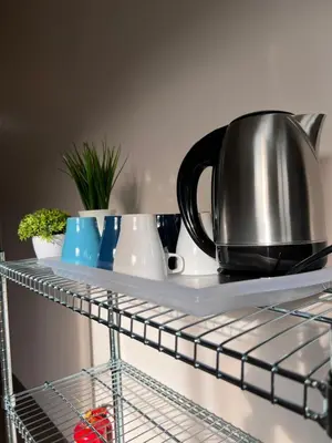 a tea kettle on a shelf in a kitchen at Room3#IG theme Bargainous#Shared Bathroom#2pax#2min Kek Lok Si in Ayer Itam