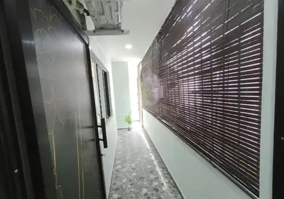 a hallway with a black and white wall at Dim Sum Homestay in Ipoh