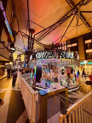 a food court in a shopping mall with a display at Emerald Avenue Apartment Madam Ng. in Cameron Highlands