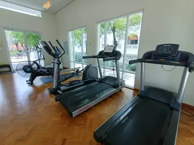 a gym with treadmills and exercise bikes in a room at Perfect Marina Stay@ Strait Quay 5 pax w/ Free Carpark in Bagan Jermal
