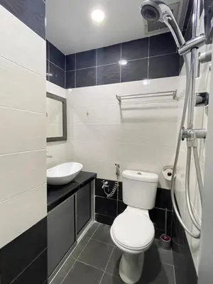 a bathroom with a toilet and a sink at MR Homestay HotelStyle Room Teluk Intan in Teluk Intan