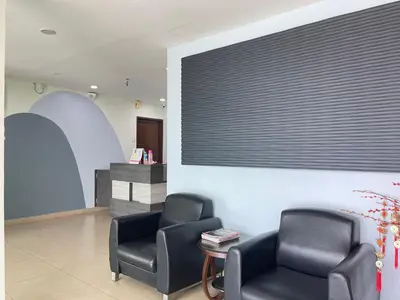 a waiting room with two chairs and a table at MR Homestay HotelStyle Room Teluk Intan in Teluk Intan