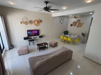 a living room with a couch and a table at 75 pangkor ocean in Pangkor