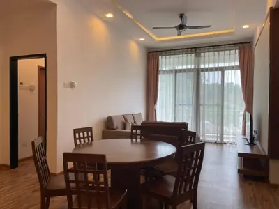 a living room with a table and chairs and a couch at NOVA Apartment at Cameron in Cameron Highlands