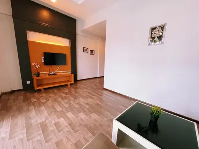 a living room with a tv on a wall at NOVA Apartment at Cameron in Cameron Highlands