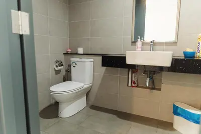 a bathroom with a toilet and a sink at The WILLOW, Studio Cityview by WStay @ Tropicana 218 Macalister in George Town