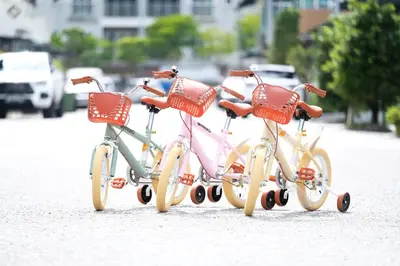 a group of three bikes parked on a street at Comfy Sofy 23- Balcony Garden (Night market) in Tanah Rata