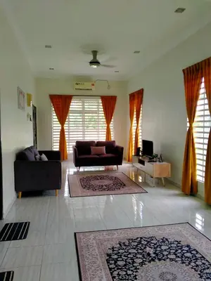a living room with two couches and a couch at Homestay Haji Din Tronoh Perak in Teronoh