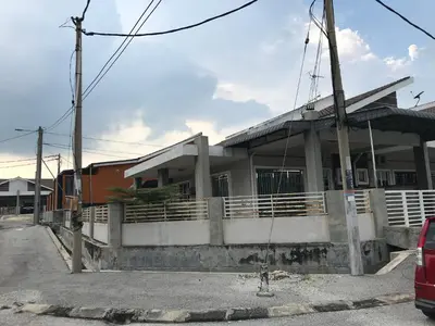 a building with a train on a street at Fidaiy Homestay in Teronoh