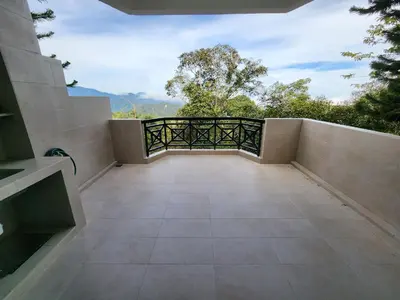 an empty balcony with a view of the mountains at Little England B3 in Bukit Fraser